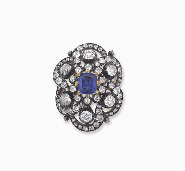 A sapphire, diamond and silver brooch