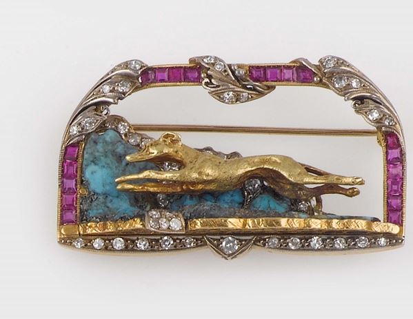 A gold and gem-set brooch. Faraone