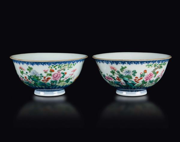 A pair of polychrome enamelled porcelain bowls with floral decoration, China, early 20th century