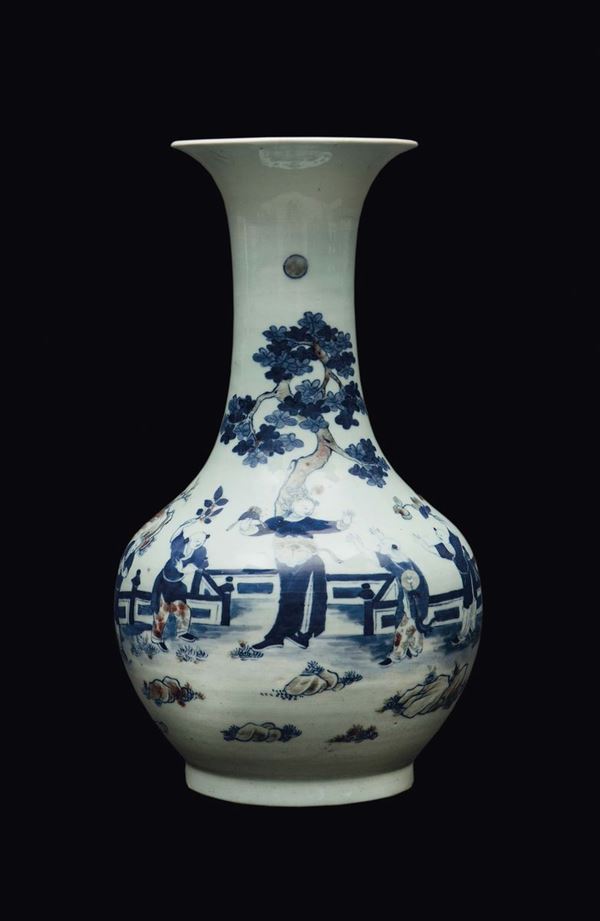 A blue and white underglazed iron red vase depicting playing children, China, Qing Dynasty, 19th century