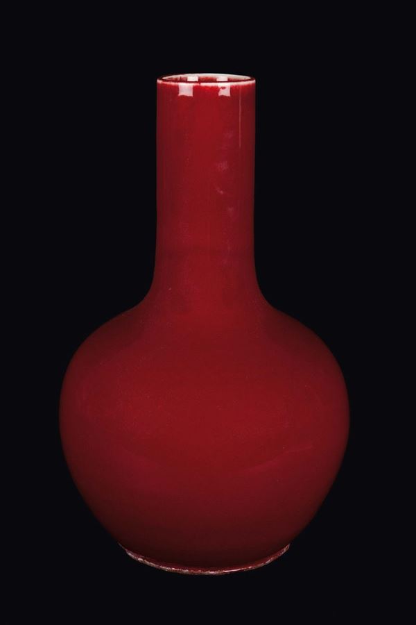 A monochrome red-glazed porcelain vase, China, Qing Dynasty, 19th century