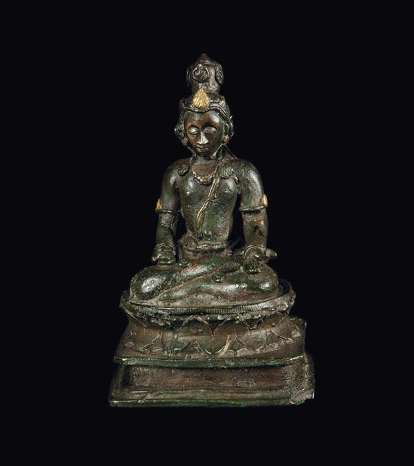 A bronze deity on a lotus flower, Burma, 14th century