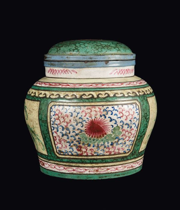 A rare Yixing glazed pottery potiche and cover with floral decoration within reserves, China, Qing Dynasty, 18th century