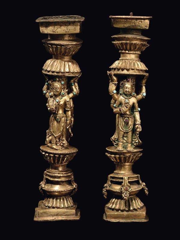 A rare pair of gilt bronze ornament with semi-precious stones inlays, Densatil monastery taste, Tibet, 15th century