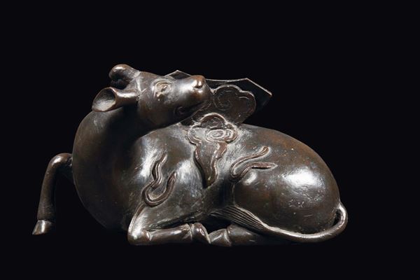 A bronze buffalo and moon mirror stand, China, Ming Dynasty, 17th century