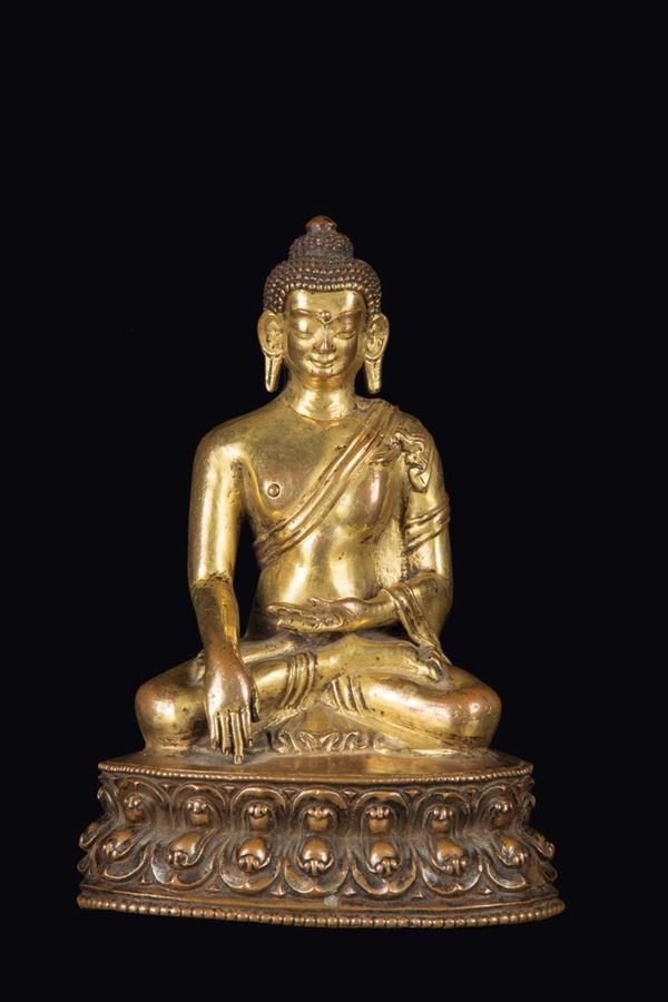 A gilt bronze figure of Sakyamuni on a double lotus flower, China, Qing Dynasty, late 17th century