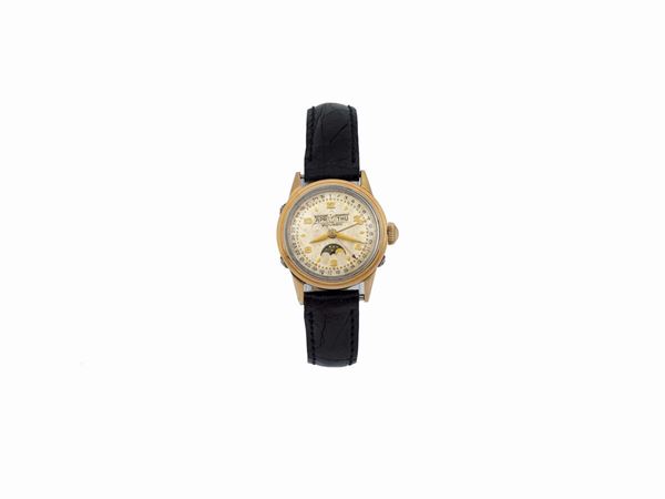 MOVADO, orologio da polso, in acciaio e laminato oro con triplo calendario e fasi lunari. Realizzato circa nel 1940