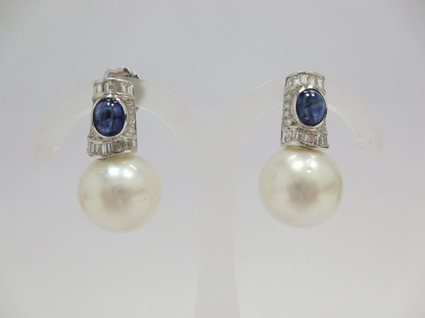A pair of cultured pearl and sapphire earrings