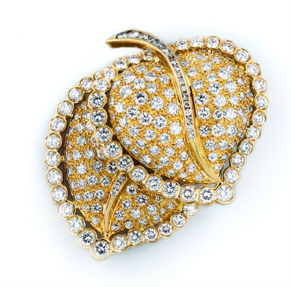 A diamond and gold brooch