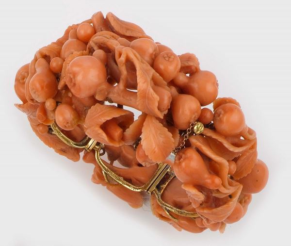 A carved coral bangle