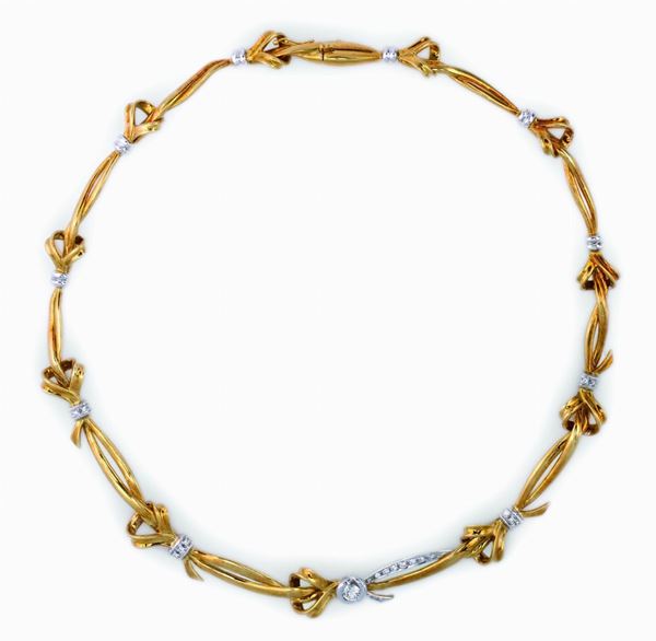 A gold and diamond necklace. Damiani