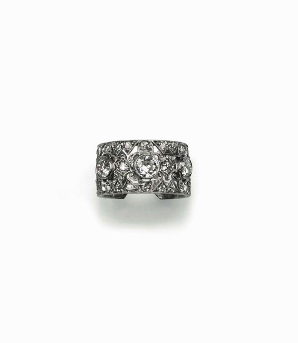 Wide band openwork ring in platinum set with three old cut diamonds