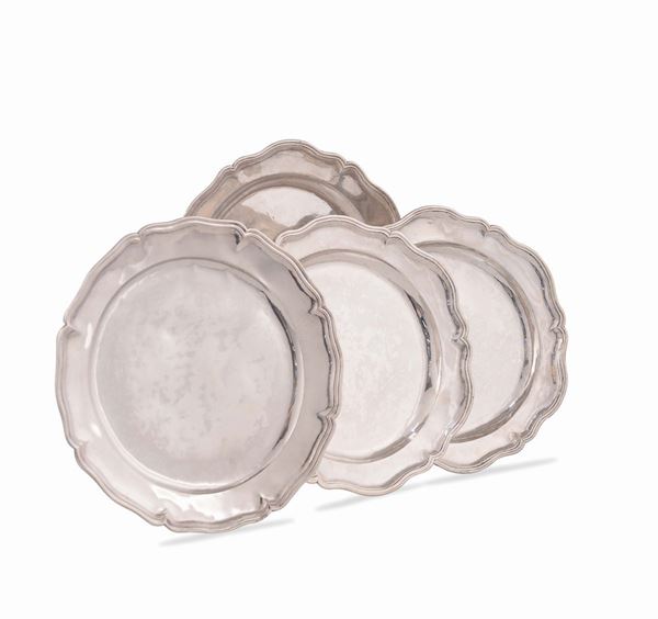 A set of four silver dishes