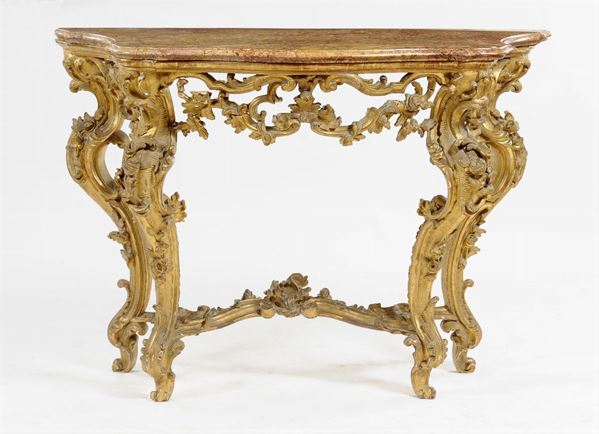 A Louis XV style, richly carved and gilt wood console table with mirror, Genoa, 18th century