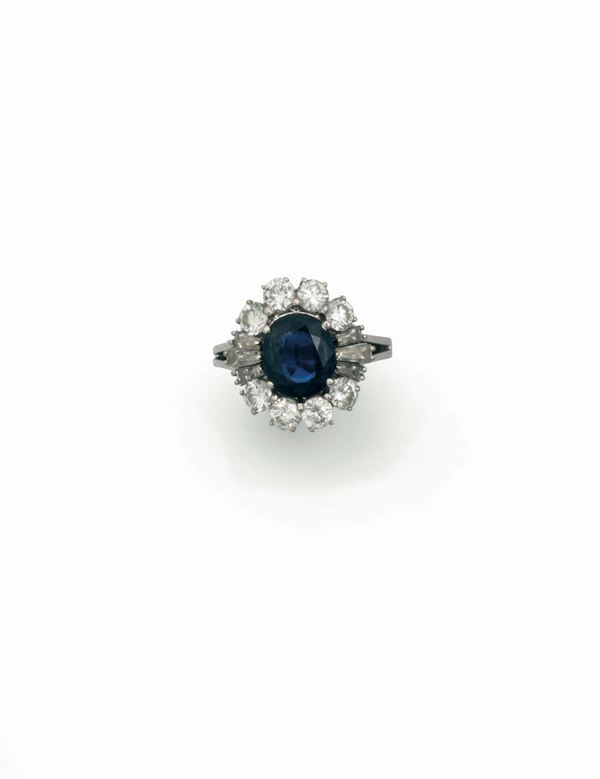 A sapphire and diamond cluster ring mounted in white gold
