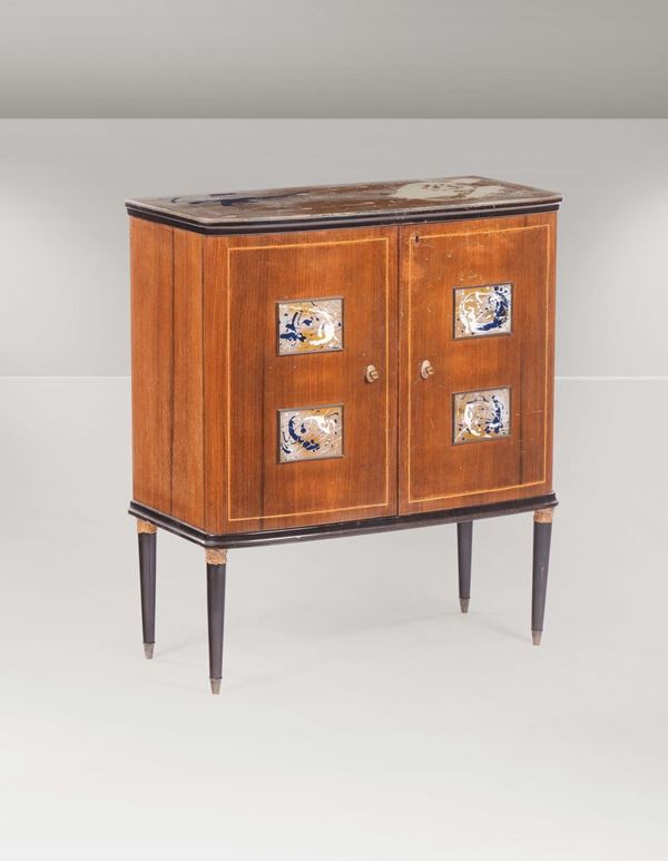 A wooden bar cabinet with brass details