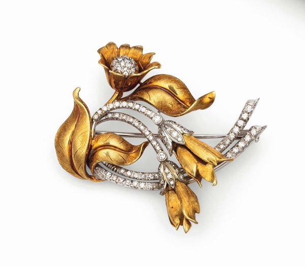 Floral brooch with diamonds set in white and yellow gold 
