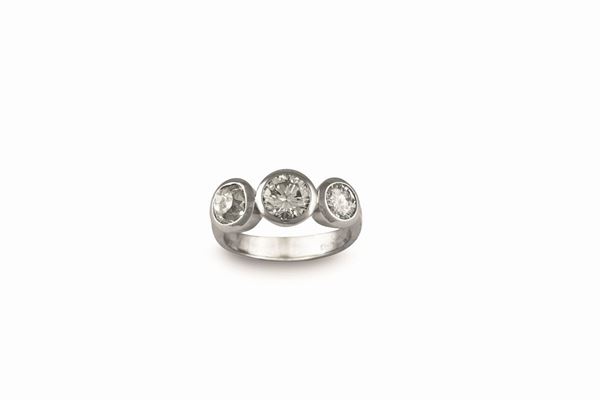 A ring with three diamonds set in white gold