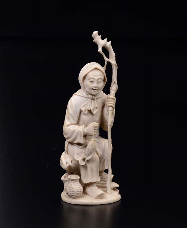 A carved ivory figure of wise man, China, early 20th century