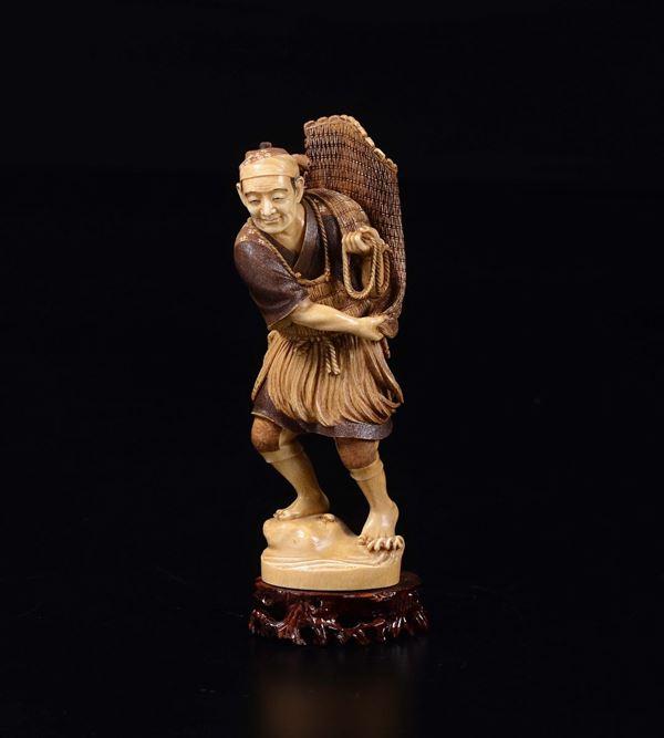 A carved ivory figure of fisherman, Japan, 19th century