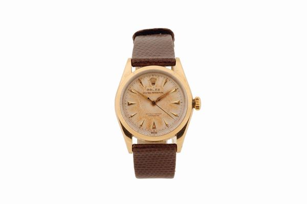 Rolex, “Oyster Perpetual, Officially Certified Chronometer, Ref. 6334, case No. 982687, rare, center seconds, water-resistant, yellow gold and steel wristwatch with original Rolex buckle. Made circa 1950