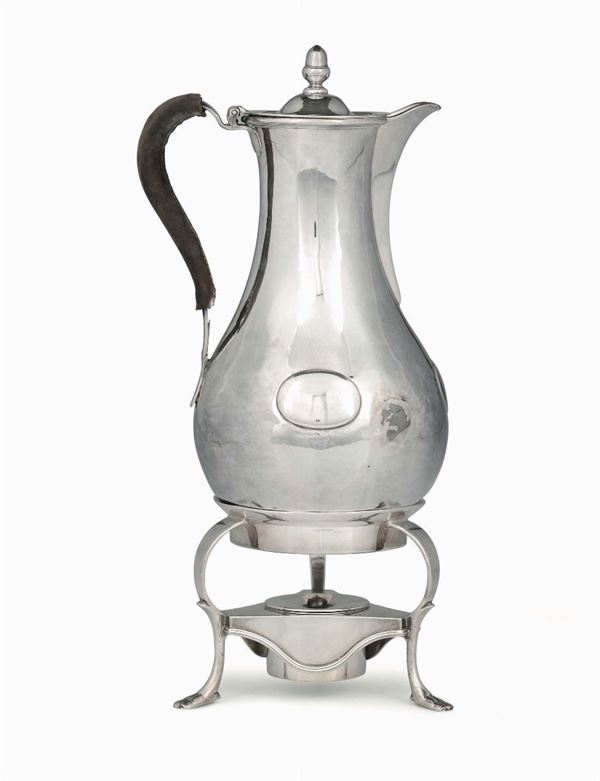A sterling silver jug on stand and burner, London 1786, makers I.W. and W.T.
