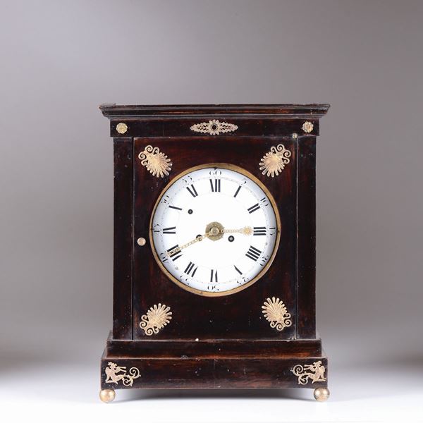 A mahogany table clock with copper leafed decorations, mid 19th century