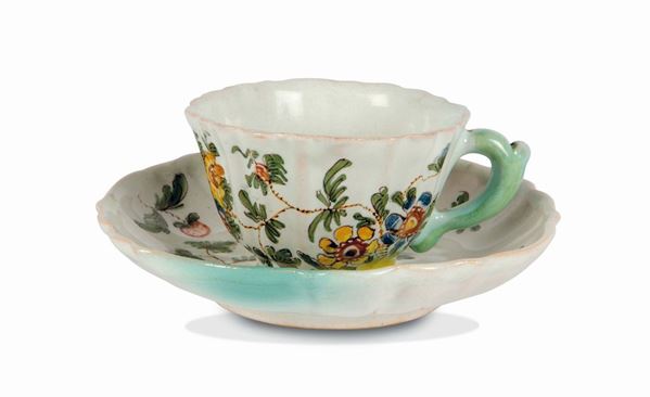 A maiolica cup and saucer, Pesaro, Casali and Callegari factory, mid 18th century