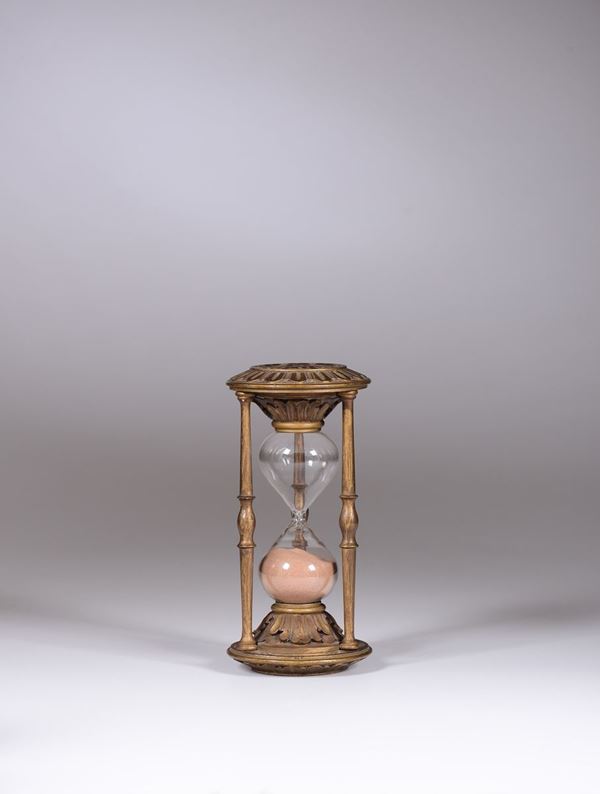 An hourglass with wooden framework, 20th century