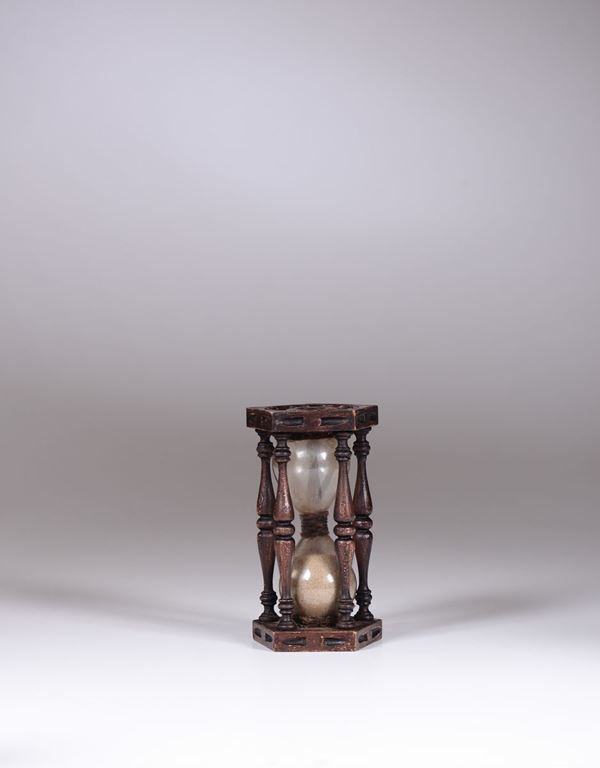 An hourglass with wooden framework, 20th century