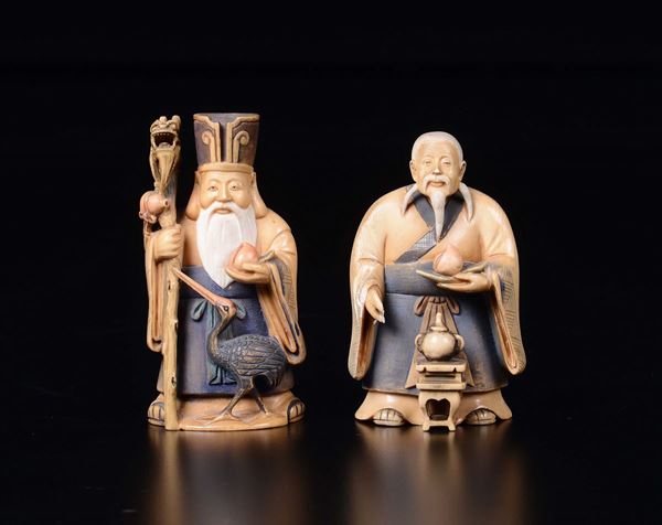Two carved figures of dignitaries with peaches, early 20th century