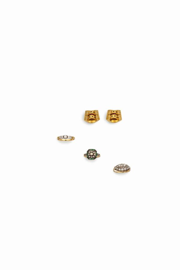 Two diamond rings, one diamond and emerald ring and a polychrome enamels pair of earrings