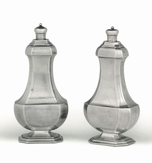 A pair of vinaigrettes or perfume bottles in molten, embossed and engraved silver, Genova 18th century