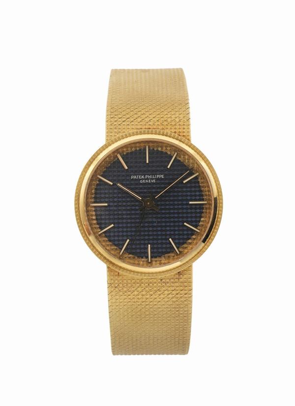 PATEK PHILIPPE, Geneve, 18K yellow gold, self-winding wristwatch with an 18K integrated Patek Philippe bracelet. Made circa 1970