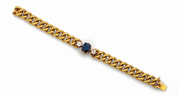 Link bracelet with central sapphire and two diamonds set in yellow gold