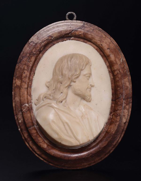 A marble oval bas-relief with the profile of Christ, 17th century Roman school