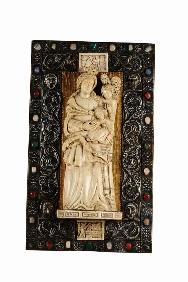 An ivory sculpture with the Virgin with Child within a silver-gilt frame and coloured stones, neo-gothic artist, 19th century