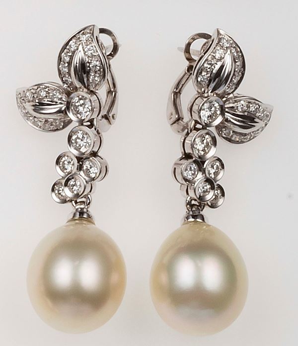 Pair of cultured pearl and diamond pendent earrings