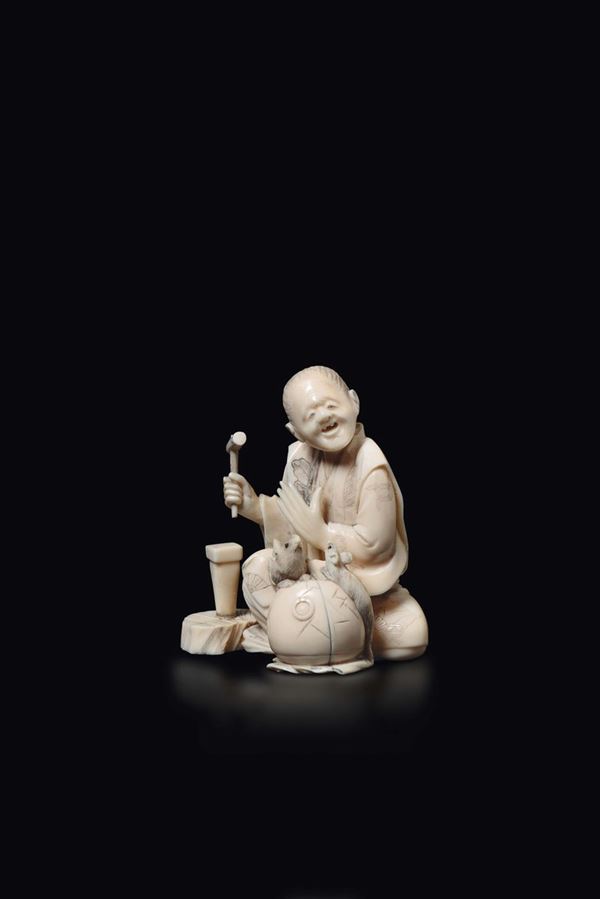A carved ivory figure of smith with small mice, Japan, early 20th century