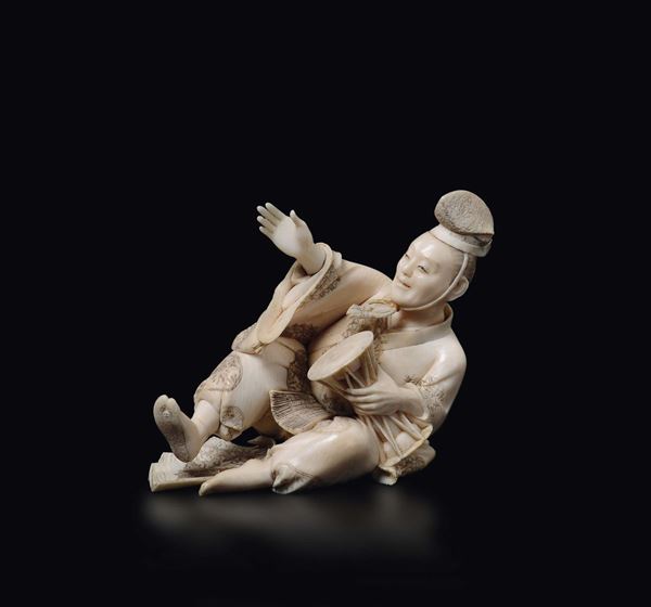 A carved ivory figure of playing tamburine, Japan, early 20th century