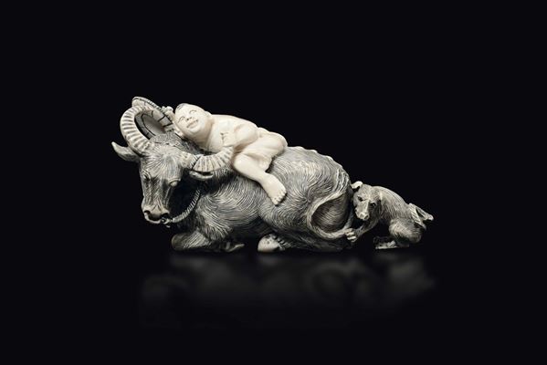 A carved ivory figure of buffalo with child and small dog, China, early 20th century