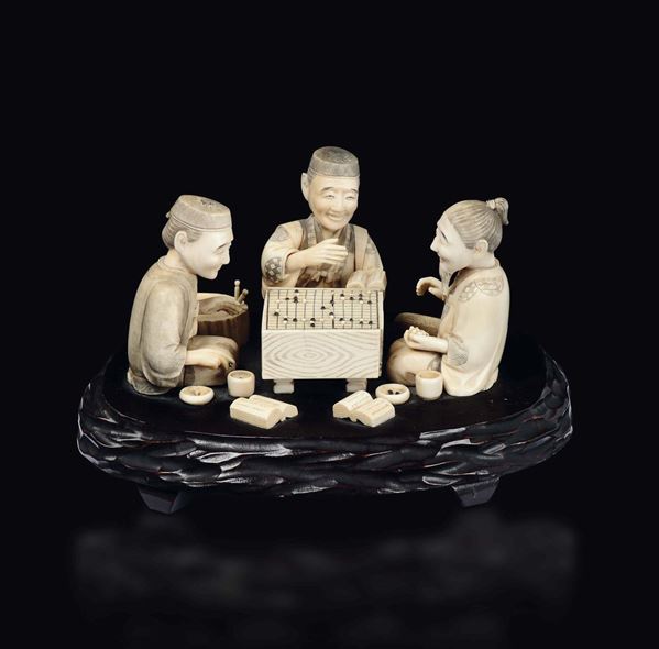 A carved ivory playing men group, Japan, early 20th century