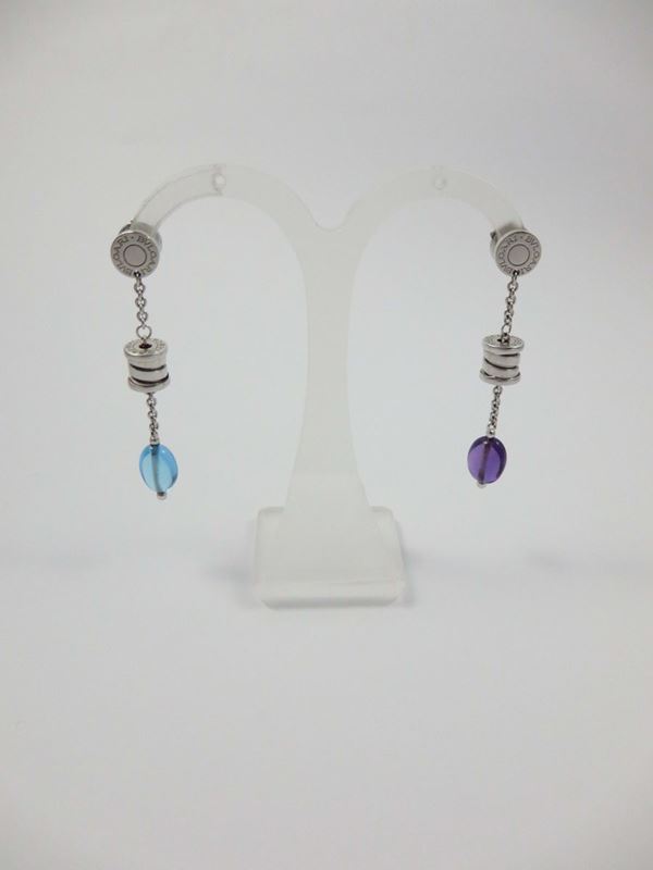 A pair of gold pendent earrings, one with a cabochon topaz and one with a cabochon amethyst. Bulgari, B.Zero1