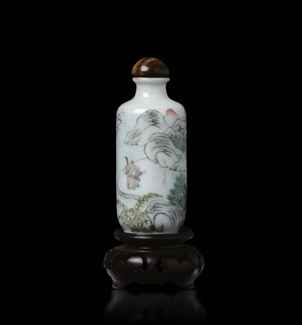 A polychrome enamelled porcelain snuff bottle with river landscape and figures, China, Qing Dynasty, 19th century