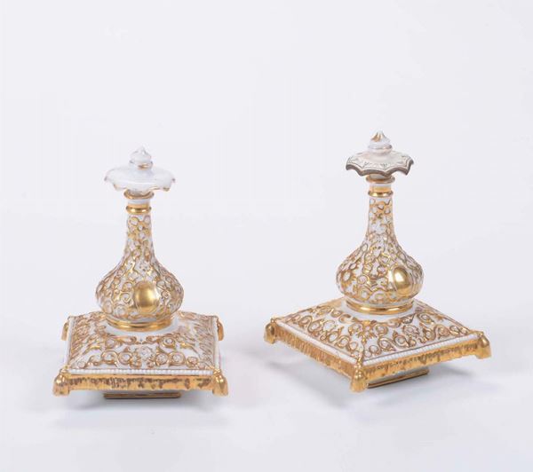 A pair of porcelain bottles with a gold arabesque decor, J. Petit, circa 1850
