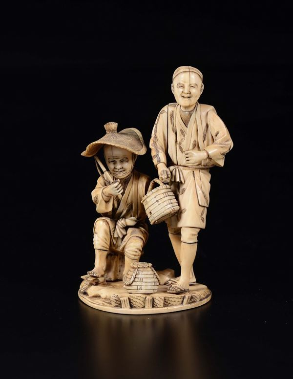A carved ivory fishermen group, Japan, 19th century