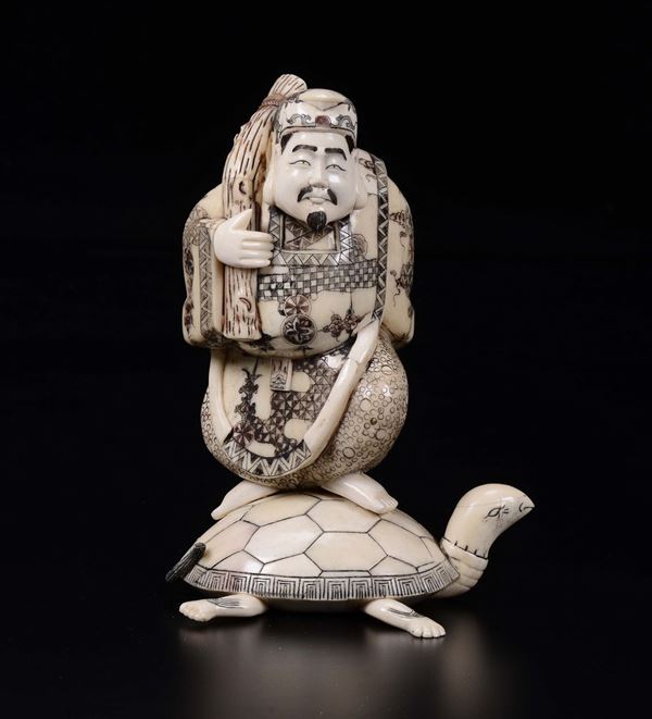 A carved ivory figure of wise man on a turtle, Japan, early 20th century