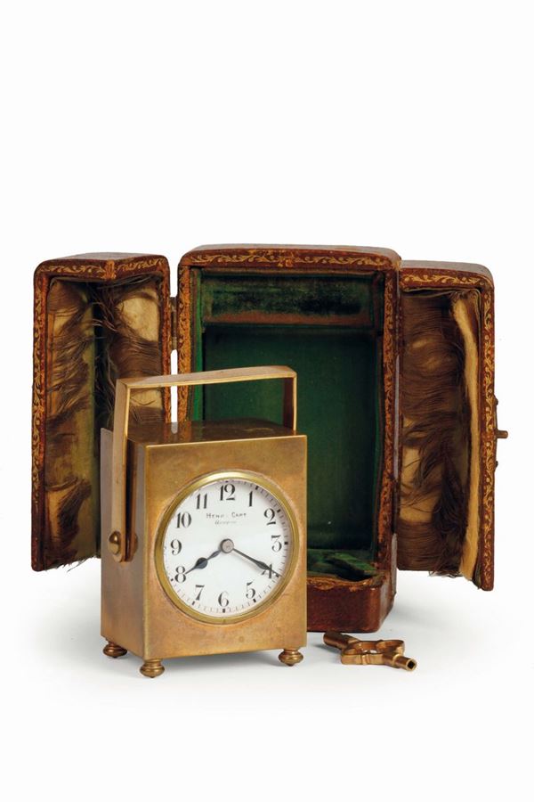 HENRY CAPT, Geneve, raro orologio con cassa parallelopipedale in ottone dorato,quadrante in smalto firmato. Corredato da astuccio e chiave originale. Realizzato nel 1900 circa