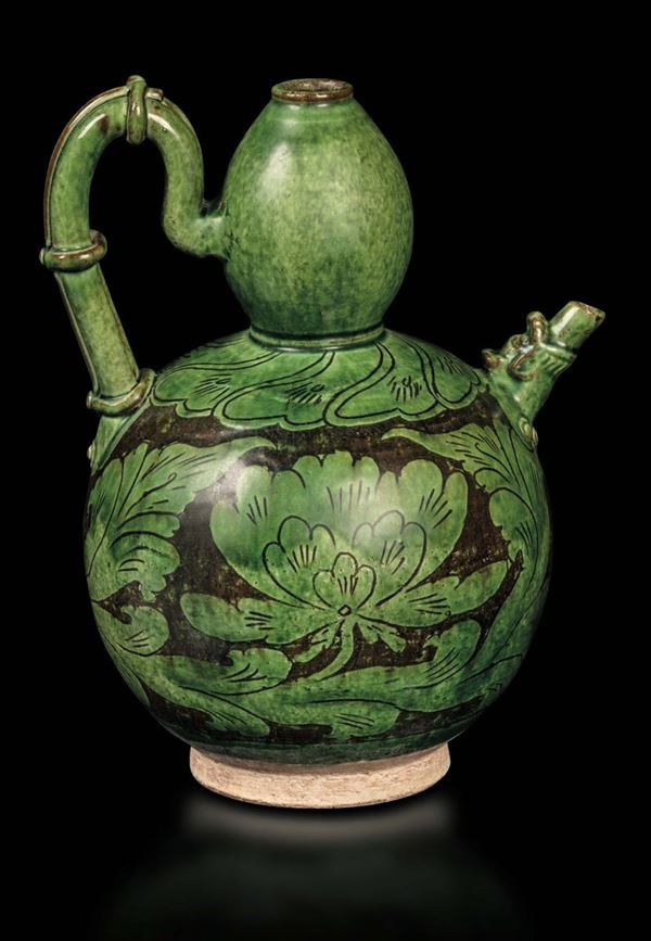 A green-glazed stoneware ewer with lotus flowers, China, probably Song Dynasty (960-1279)