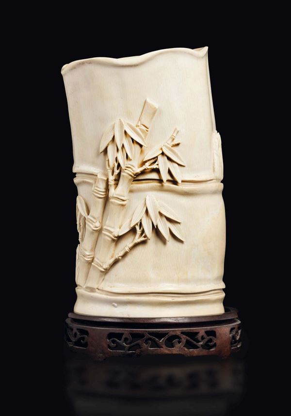 A carved ivory brushpot with bamboo in relief, China, Qing Dynasty, 19th century
